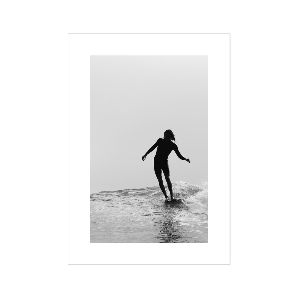 Fine art print showing a surfer in black and white, inspired by a bohemian vibe on high quality fine art paper.